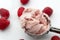 Refreshing cold sweets, seasonal dessert and cool summertime treat concept with close up on scoop of vivid pink raspberry ice