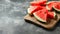 Refreshing Delight: Fresh Watermelon on a Grey Table