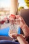 Refreshing drink in the summer: Girl is holding glass with cold beverage