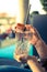 Refreshing drink in the summer: Girl is holding glass with cold beverage