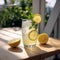 Refreshing glass of ice-cold lemonade with lemon slices and mint garnish