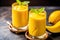 Refreshing and healthy mango smoothie in tall glasses. Generative AI