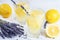 Refreshing lavender lemonade in glasses on white wooden background