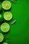 Refreshing Lime and Cut Lime on Green Background AI Generated