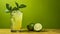 Refreshing lime juice in glass on wooden table with soft green background for text placement