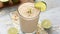 Refreshing Lime and Oatmeal Smoothie in Glass on Light Background