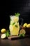 Refreshing mint lemonade in a jug fresh and delicious beverage with copy space. Vertical