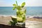 Refreshing mojito cocktail against the backdrop of a serene tropical beach scene. Ai generated