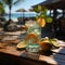 Refreshing orange juice drink on the background of the tropical nature. Glass of Refreshing cold lemon drink composition on a