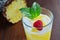 Refreshing pineapple cocktail drink with ice and mint