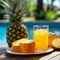 Refreshing pineapple juice drink with ice in a glass on the background of the tropical nature. Glass of Refreshing cold fruit