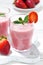 Refreshing strawberry milkshake, vertical closeup