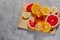 Refreshing summer citrus coctail drink on the concrete background