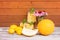 Refreshing summer melon lemonade, lemons, melon and echinacea flowers on aged wooden table