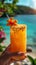 Refreshing tropical mango cocktail garnished with a flower, perfect for summer beach vacations.