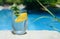 Refreshing water with lemon and mint on rock outdoors