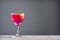 Refreshing watermelon cocktail in a glass on a gray background