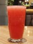 Refreshing Watermelon Juice in Glass on Wooden Bar Table