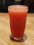 Refreshing Watermelon Juice in Glass on Wooden Bar Table