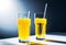 refreshing yellow carbonated drink in a tall glass. Cold glass, drops of condensation, orange juice, lemon juice,