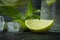 Refreshment mojito cocktail with mint and lime in a glass mug on a black background