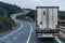 Refrigerated truck driving on a conventional road