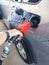 Refueling a car at a gas station. The driver fills up his car with gasoline