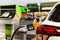 Refueling cars tank with gas oil at petrol station.