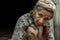 Refugee people, Old refugee woman in temporary shelter at refugee camp in Thailand, Selective focus