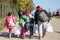 Refugees walking carrying heavy bags on the Croatia Serbia border, between the cities of Bapska and Berkasovo on the Balkans Route
