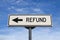 Refund road sign, arrow on blue sky background. One way blank road sign with copy space