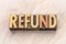 Refund word abstract in wood type