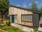 A refurbished 1960`s bungalow clad with external western red cedar and black timber rainscreen cladding