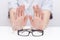 Refusal of glasses for sight. hands refuse glasses. cross on glasses. Vision improvement,