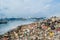 Refuse area near harbor view full of smoke, litter, plastic bottles,rubbish and trash at the Thilafushi local tropical island