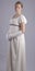 Regency woman in cream dress on studio backdrop
