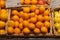 Regensburg, Germany - 2021 02 05: Unpacked organic clementines in basket with price tag on display in organic super market