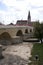 Regensburg, Germany - August 23, 2020 - just renovated stone bridge from the 12th century