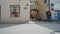 REGENSBURG, GERMANY - MAY 25, 2019: Cyclists drive on street past camera, arch