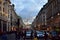 Regent Street with Christmas lights crowded with people. London, United Kingdom.