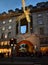 Regent Street with Christmas lights crowded with people. London, United Kingdom.