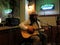 Reggae Musician Keith Batlin sings and plays guitar as he jams