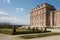 Reggia di Venaria castle architecture and park with pyramidal hedges in spring sunlight