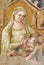 REGGIO EMILIA, ITALY - APRIL 12, 2018: The old fresco of Madonna with the child church Chiesa di San Agostino