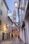 Reggo Emilia - The street of the old town at dusk with the San GIorgio church