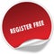 REGISTER FREE text on realistic red sticker on white background.