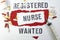 Registered Nurse wanted written with stamp letters