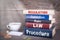 Regulation concept. Stack of books on wooden desk