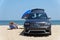 Rehoboth Beach, Delaware, U.S - August 12, 2023 - A Jeep Grand Cherokee with surf fishing permit parked on the sand by Cape