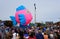 Rehoboth Beach, Delaware, U.S.A - October 26, 2019 - A big pink and blue fish float on Seawitch Festival parade and spectators on